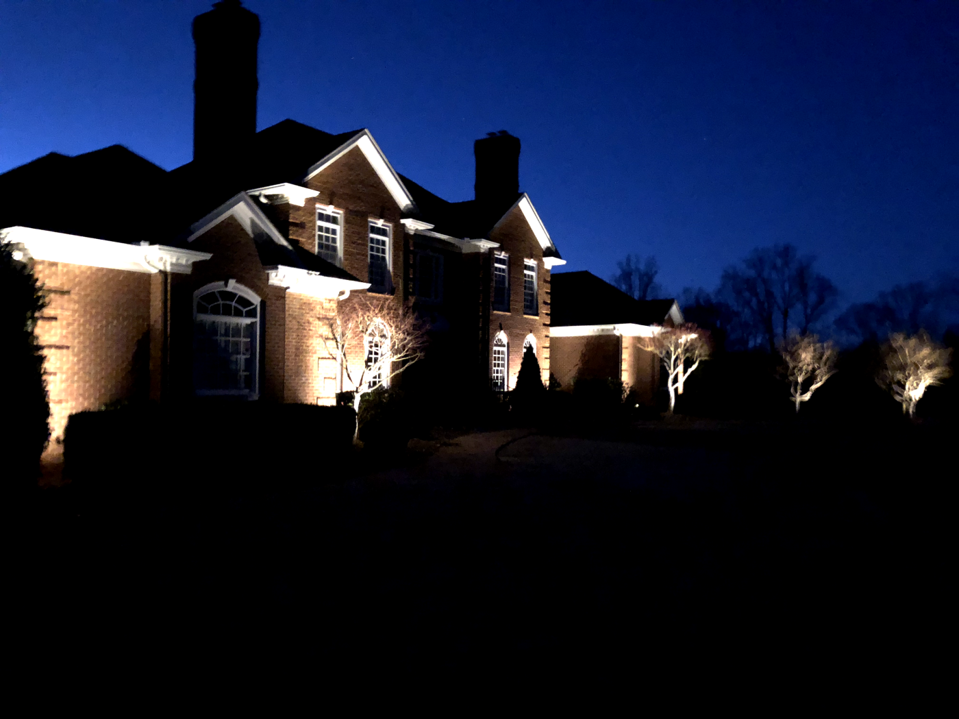 A house with lights on the outside of it