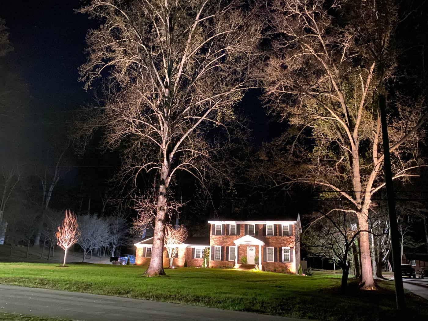 A house with lights on the outside of it