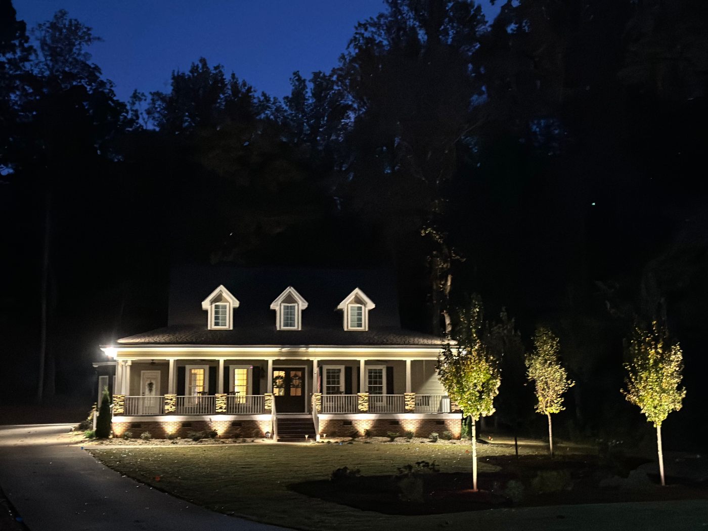 A house with lights on the front of it